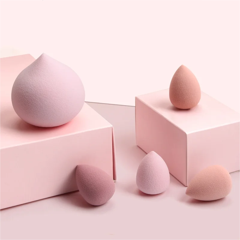 Merit Sell wet and dry makeup blender set with five pink and peach makeup sponges in various shapes and sizes