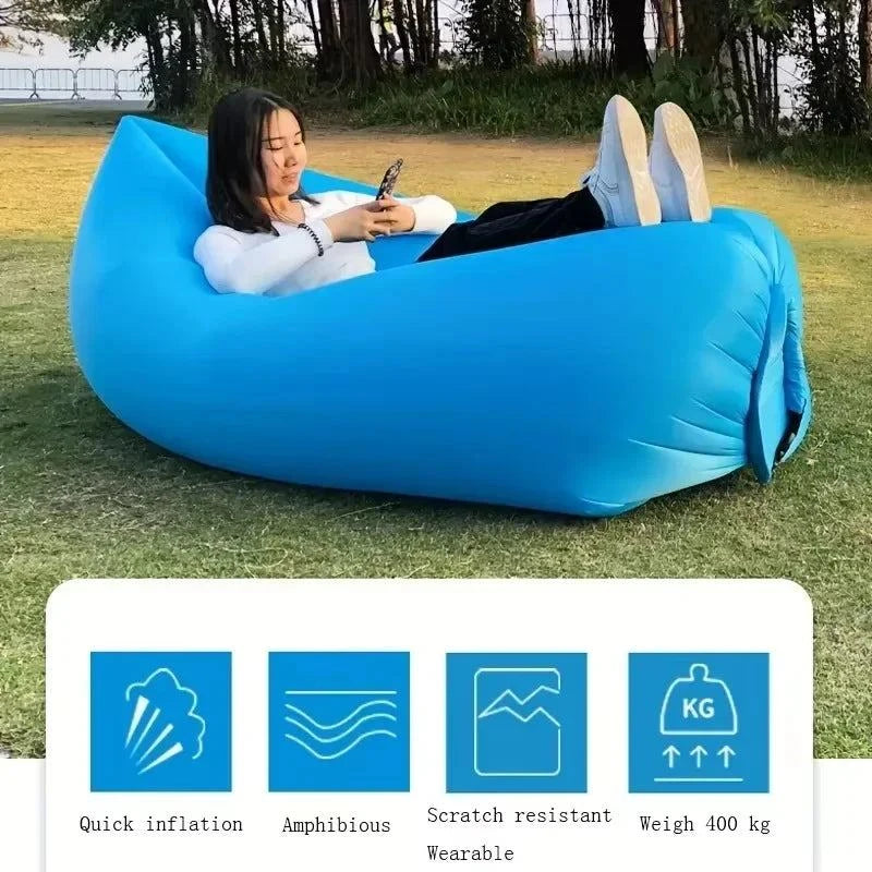 Blue inflatable lazy sofa bed by Merit Sell with quick inflation and scratch resistant features shown outdoors