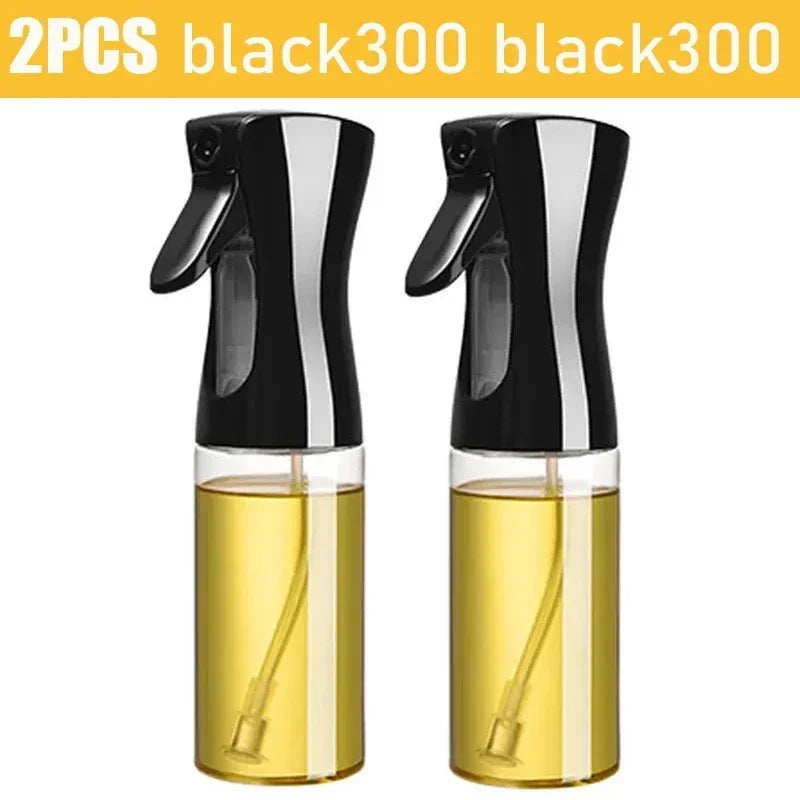 Set of 2 black kitchen oil dispenser sprayer bottles with transparent containers filled with oil