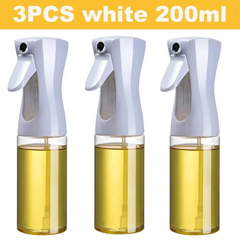 Set of three white 200ml kitchen oil dispenser sprayer bottles filled with yellow oil