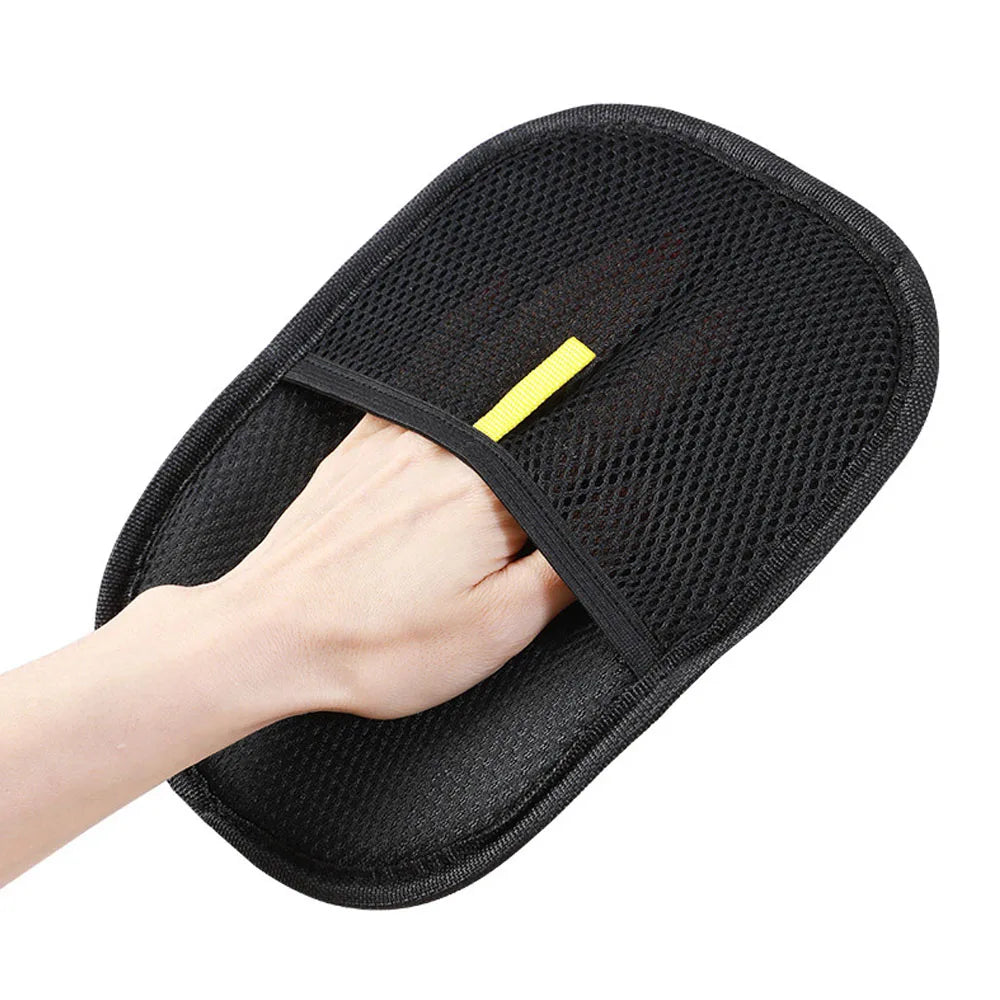 Merit Sell black pet hair remover glove with mesh design worn on hand for pet grooming