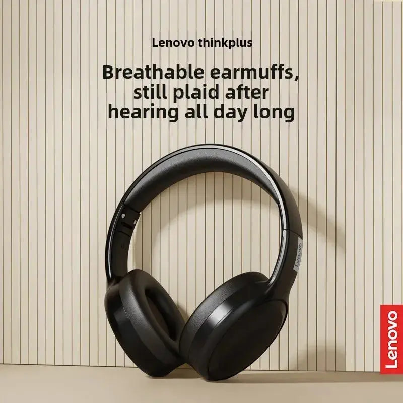 Black headphones on a textured beige background with Lenovo branding.