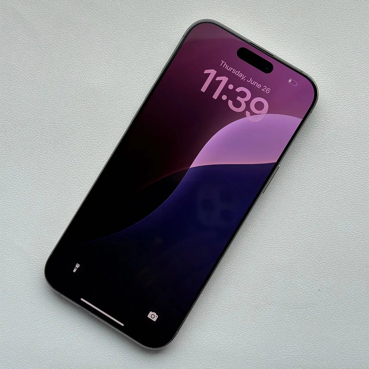 Apple iPhone 16 Pro Max 256GB unlocked with purple and black abstract wallpaper on display