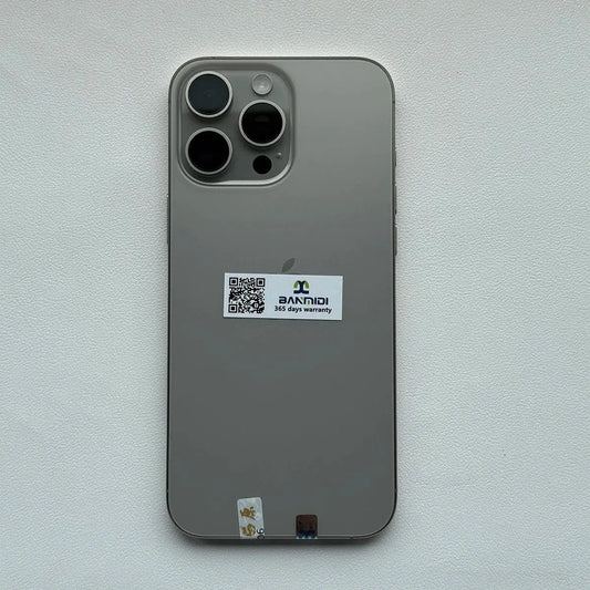 Apple iPhone 16 Pro Max 256GB unlocked in silver showing the back with triple camera setup and warranty sticker Merit Sell
