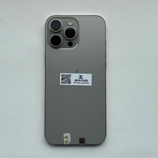 Apple iPhone 16 Pro Max 256GB unlocked in silver showing the back with triple camera lenses and warranty sticker