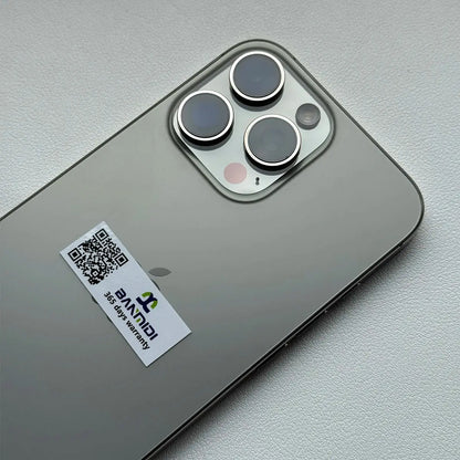 Apple iPhone 16 Pro Max 256GB unlocked shown from back with triple camera lenses and warranty sticker