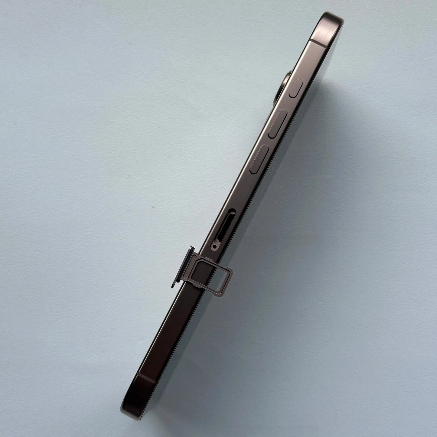 Side view of iPhone 16 Pro Max showing SIM card tray with ejector pin to buy iPhone 16 Pro Max 256GB online