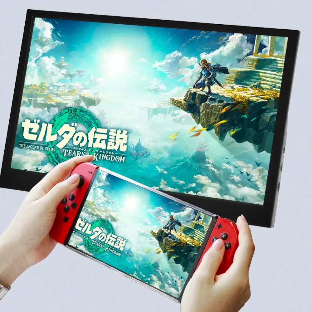 black computer monitor gaming front view displaying vibrant game screen with handheld red controller