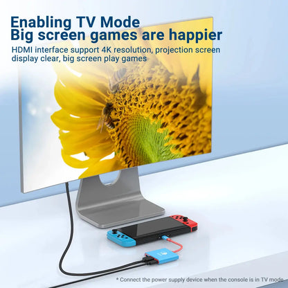 blue usb to usb-c hub connected to gaming console and monitor front angle