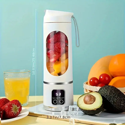 White ninja blast portable blender filled with fruit beside fresh avocado and glass of juice